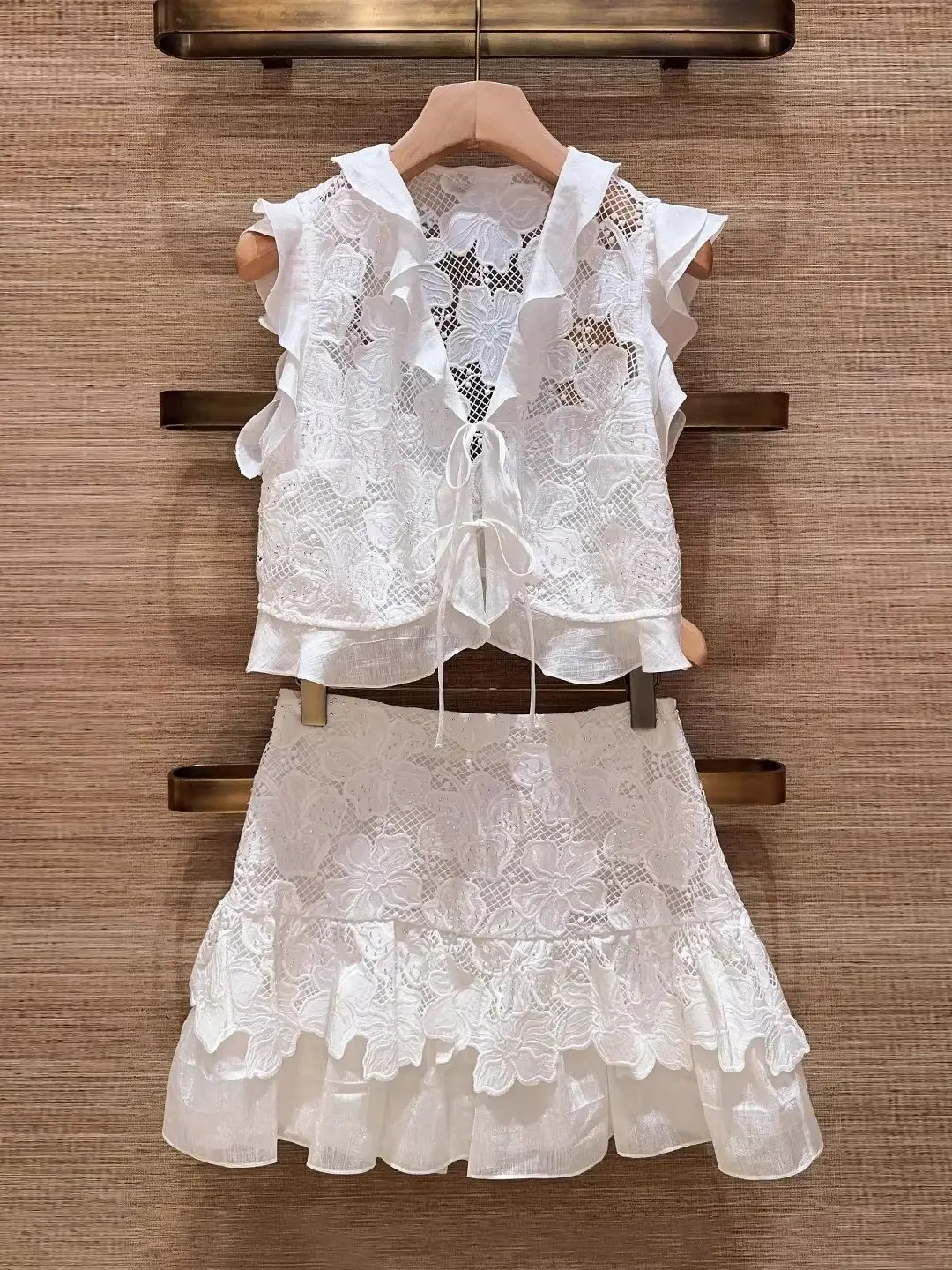 

Women Hook Flower Hollow Set Summer 2026 Ruffles Stitching V-Neck Sleeveless Vest Top + High Waist A-Line Mini Skirt Sweet Suit