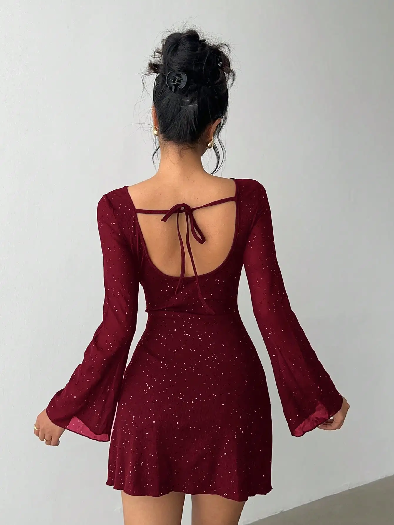 

Red Glitter Long Sleeve Backless Mini Dress with Bow Tie Detail for Holiday Parties