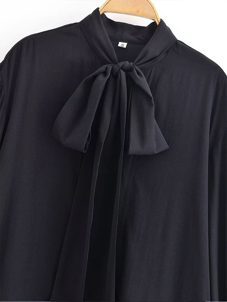 European style new women's fashion versatile elegant solid color long-sleeved shirt with bow detail and round neckline.