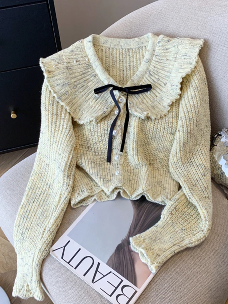 

New Winter Retro High Street Pearl Buckle Bow Women's Waist Knitted Sweater French Fashion Women Sweet Doll Neck Short Sweater