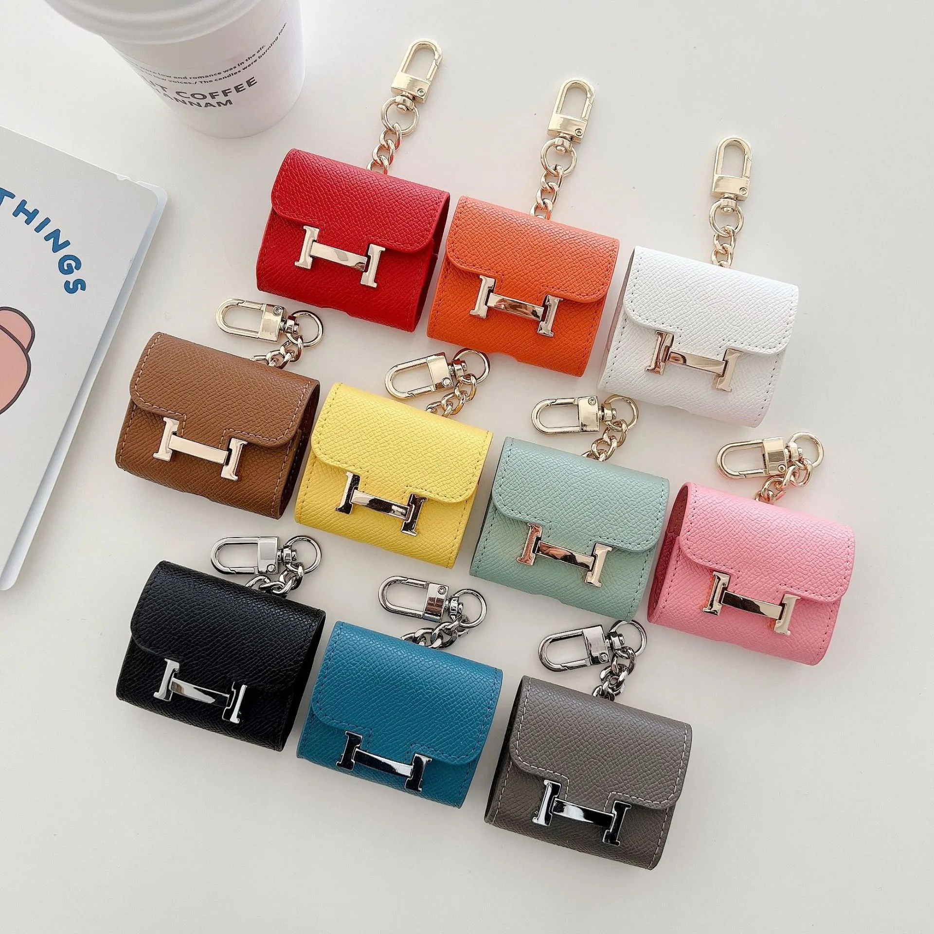 Mini earphone case with cute design, H-shaped keychain for bag accessory, suitable for AirPods 1/2/3 generation protective case.