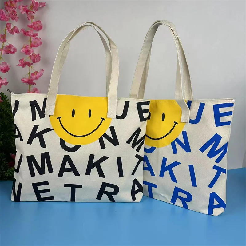 Borsa Tote con stampa facciale di lettere e Smily, borsa a tracolla in tela di grande capacità, borse con cerniera alla moda per la scuola dello