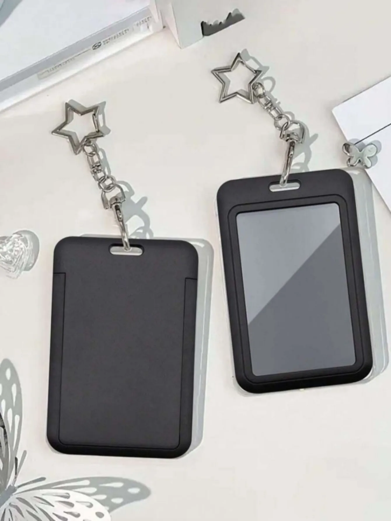 This card holder, with a star-shaped pendant, can be used as a bag charm or keychain. It can store ID cards, celebrity cards,