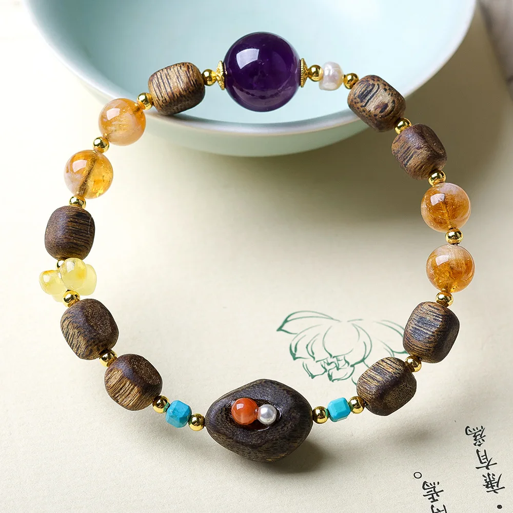 

Hainan GreenQinan agarwood scar tree heart material bracelet paired with amethyst citrine beeswax osmanthus flower bracelet for