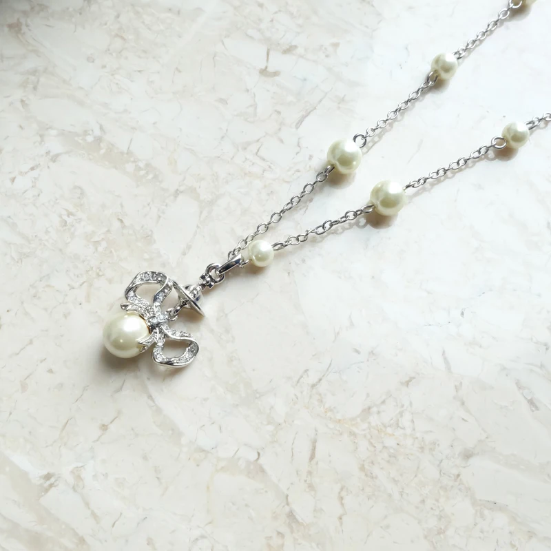 

S925 Sterling Silver Half Bow Pearl Saturn Pendant Necklace Niche Design Accessories Fashion Versatile temperament