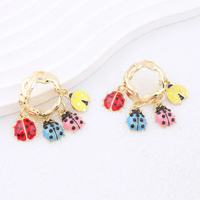 European and American style unique ladybug dangling tassel earrings with oil-drop pattern, perfect for vacation or travel.