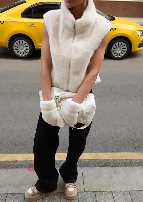 

Autumn and winter new solid color sleeveless zipper vest imitating mink fur grass high neck loose plush jacket for women