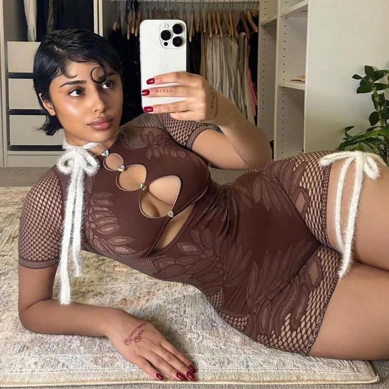 

BKLD 2025 New Solid Color Round Neck Slim Fit Sexy Night Club Outfits Hollow Out Knitted One Pieces Bodycon Rompers For Women