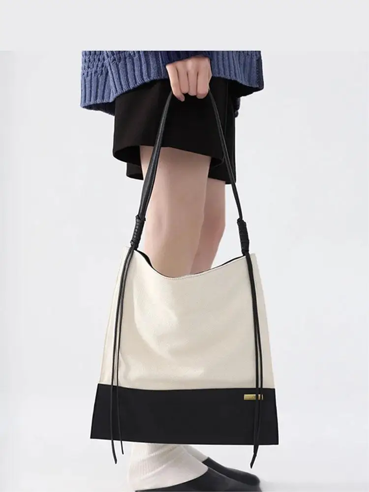 

New Spliced Contrasting Color Bucket Shaped Canvas Women's Bag Light Luxury Fashionable And High-end Single Shoulder Women's Bag