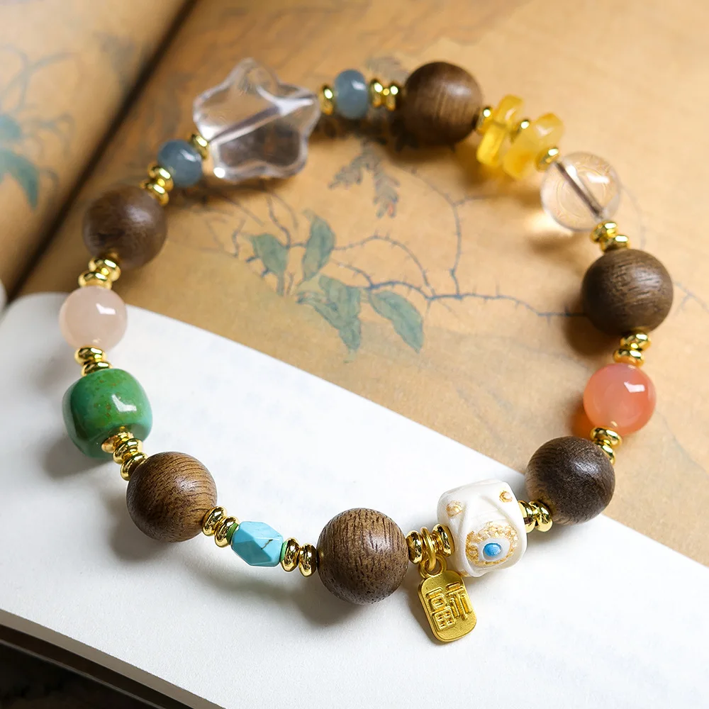 

Natural White Crystal Bracelet with Aquilaria sinensis Wood Devil's Eye Bracelet with Red Agate Root Tassel