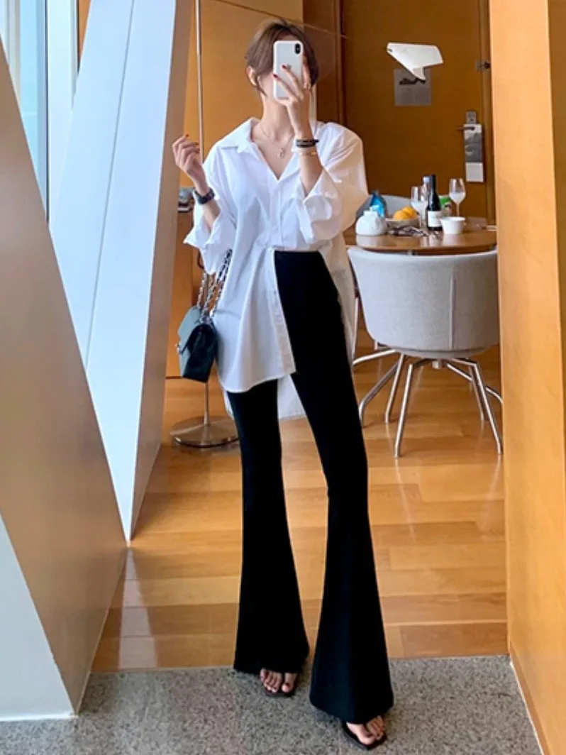 เสื้อยืดแฟชั่นลำลองผู้หญิงสไตล์ชิคต้นฤดูใบไม้ร่วงหลวมแขนยาวคอตั้งไม่สมมาตรด้านข้างผ่าด้านข้าง