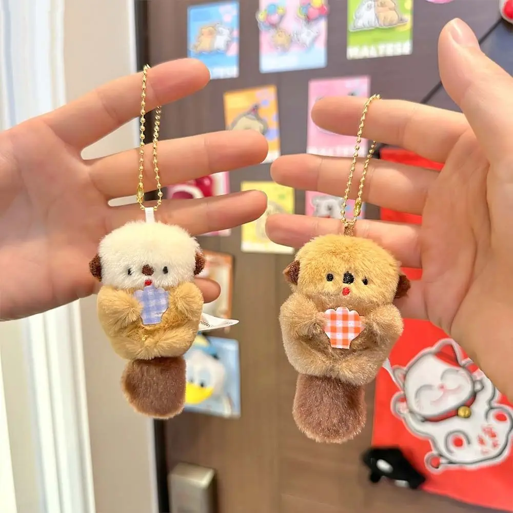 ตุ๊กตาน่ารัก Otter Hold Shell Key Chain Trinket Plush กระเป๋าเป้สะพายหลัง Charms การ์ตูนเกาหลีสไตล์อะนิเมะ Key แหวนหญิง