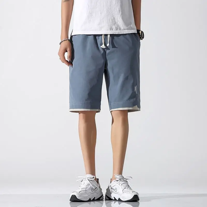Pantaloni ort sottili in seta di ghiaccio estiva da uomo nuovi Pantaloni larghi a cinque punti larghi per sport da spiaggia casual leggeri