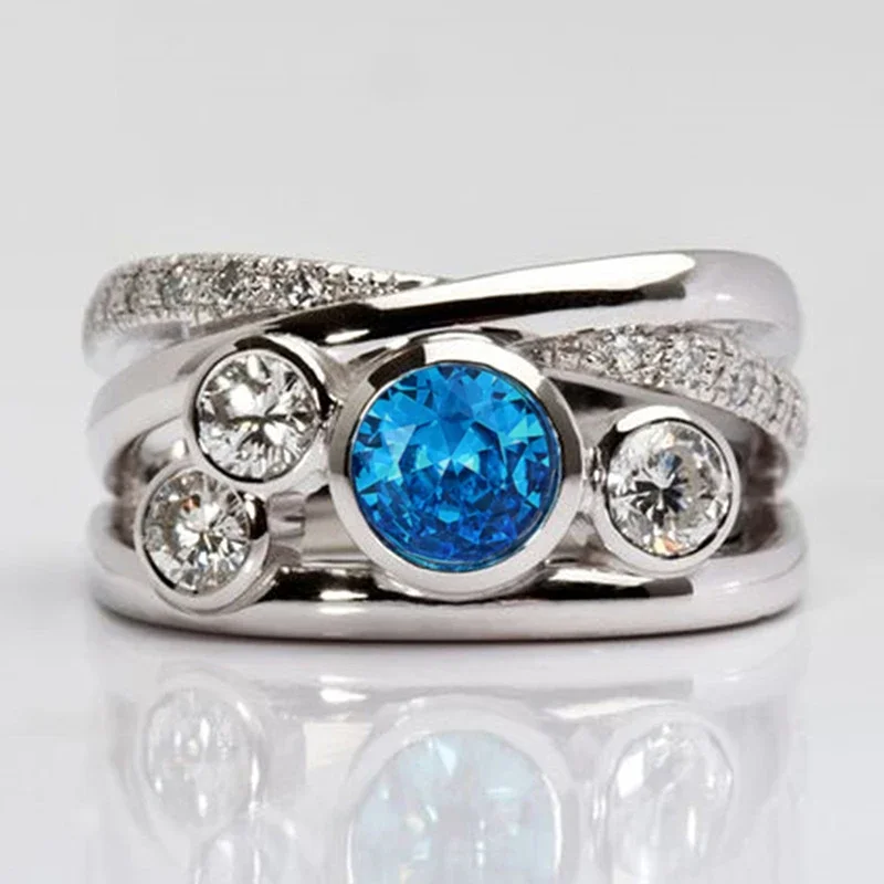 خاتم نسائي فضي اللون من Huitan مرصع بالزركون الأزرق المتلألئ وإكسسوارات ساحرة عصرية مجوهرات أنيقة للحفلات اليومية #2