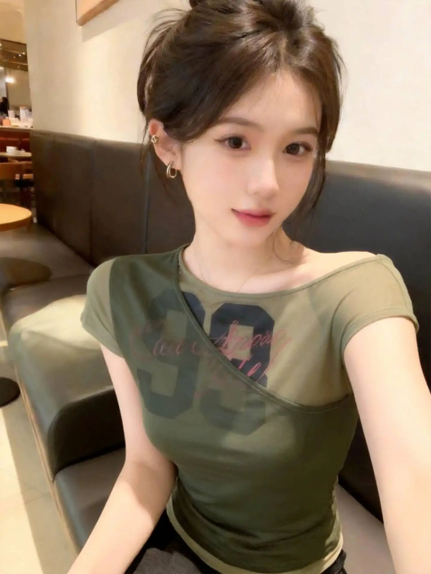 

2026 Early Summer New Women Green Letter Print Fake Two piece Short Sleeve T-shirt Fashion Off Shoulder Trendy Casual Daily Tops