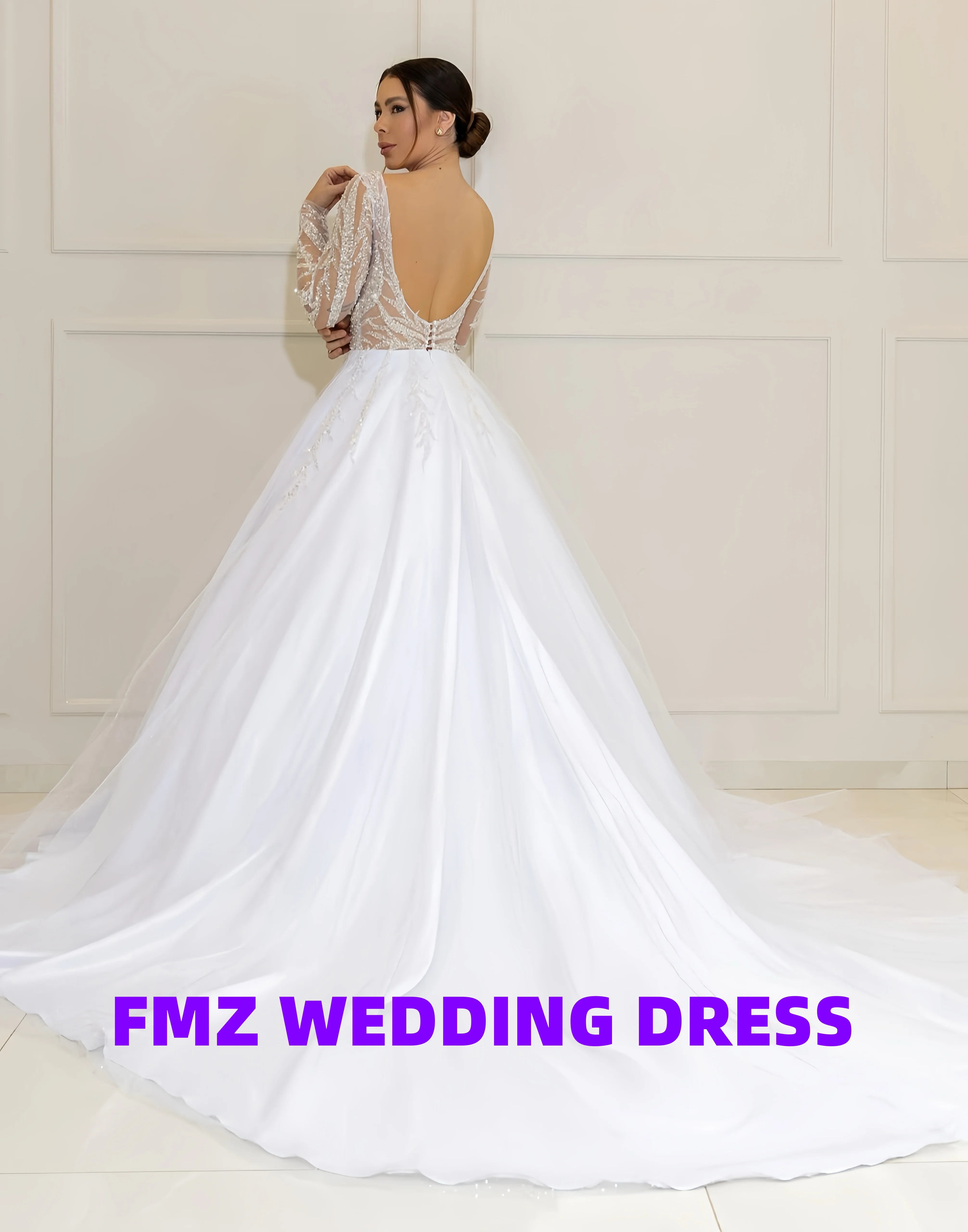 فستان زفاف فاخر مطرز برقبة على شكل حرف v وأكمام طويلة على شكل حرف a من فيستدوس دي نوفيا رداء دي ماري