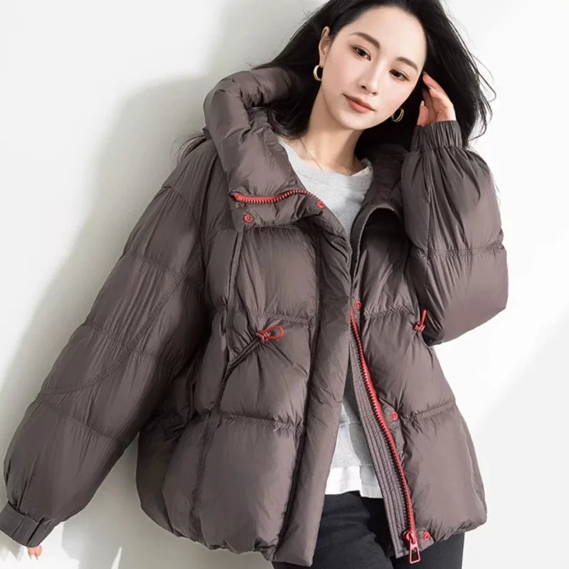 سترة مبطنة بغطاء للرأس دافئة بسحّاب كامل للنساء شتاء دافئ بلون سادة سترات فضفاضة للنساء موضة جديدة لعام 2025 معطف قطني للشارع #1