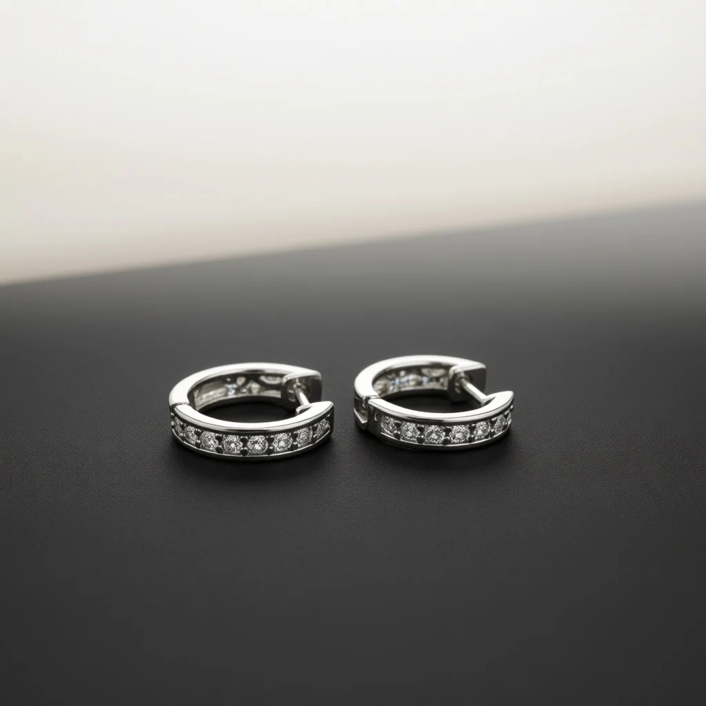 Silver‑Tone Huggie Hoop Earrings for Women, Pave Clear Zircon Hollow Cut‑Out Click‑Top Ear Hoops, Sleek Fashion Jewelry