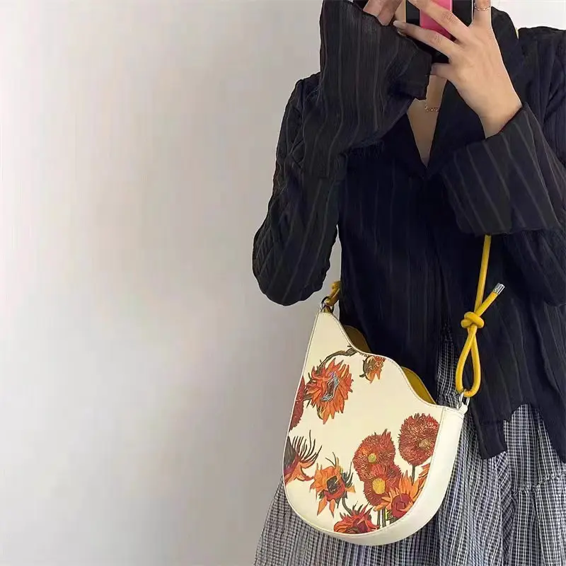 2025 new fashion women's leather leather retro sunflower seed rope knot and color paint series handheld armpit crossbody bag