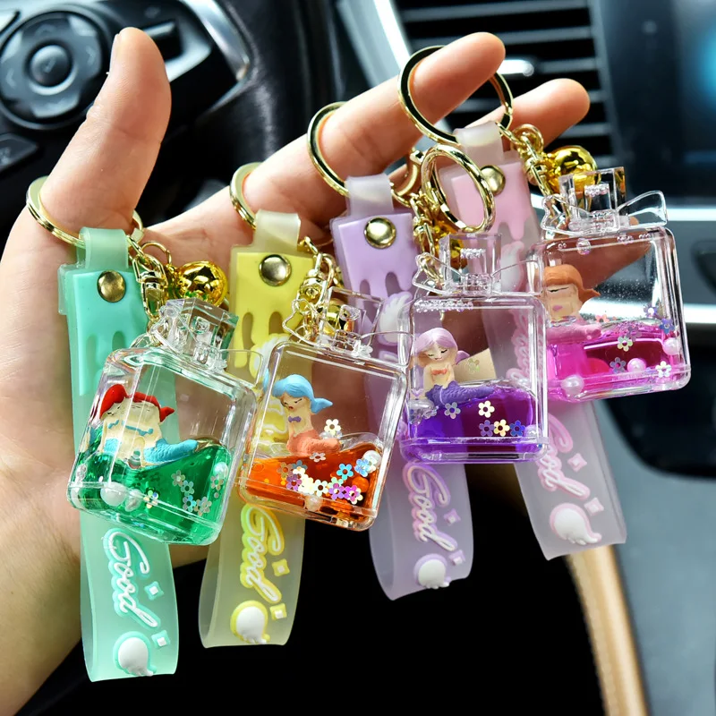 Creative Oil Liquid Quicksand Perfume Bottle Floating Doll Keychain Acrylic Handbag Pendant Wholesale