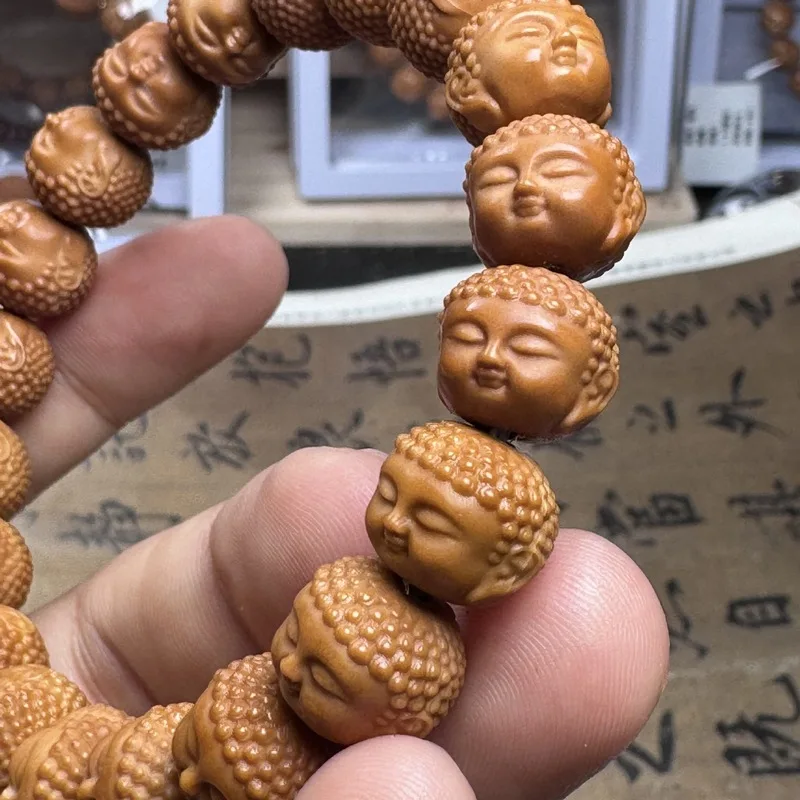 Hand-carved , baby Buddha monkey head walnut bracelet, Beijing-style eight-sided peach-shaped beads magic bea