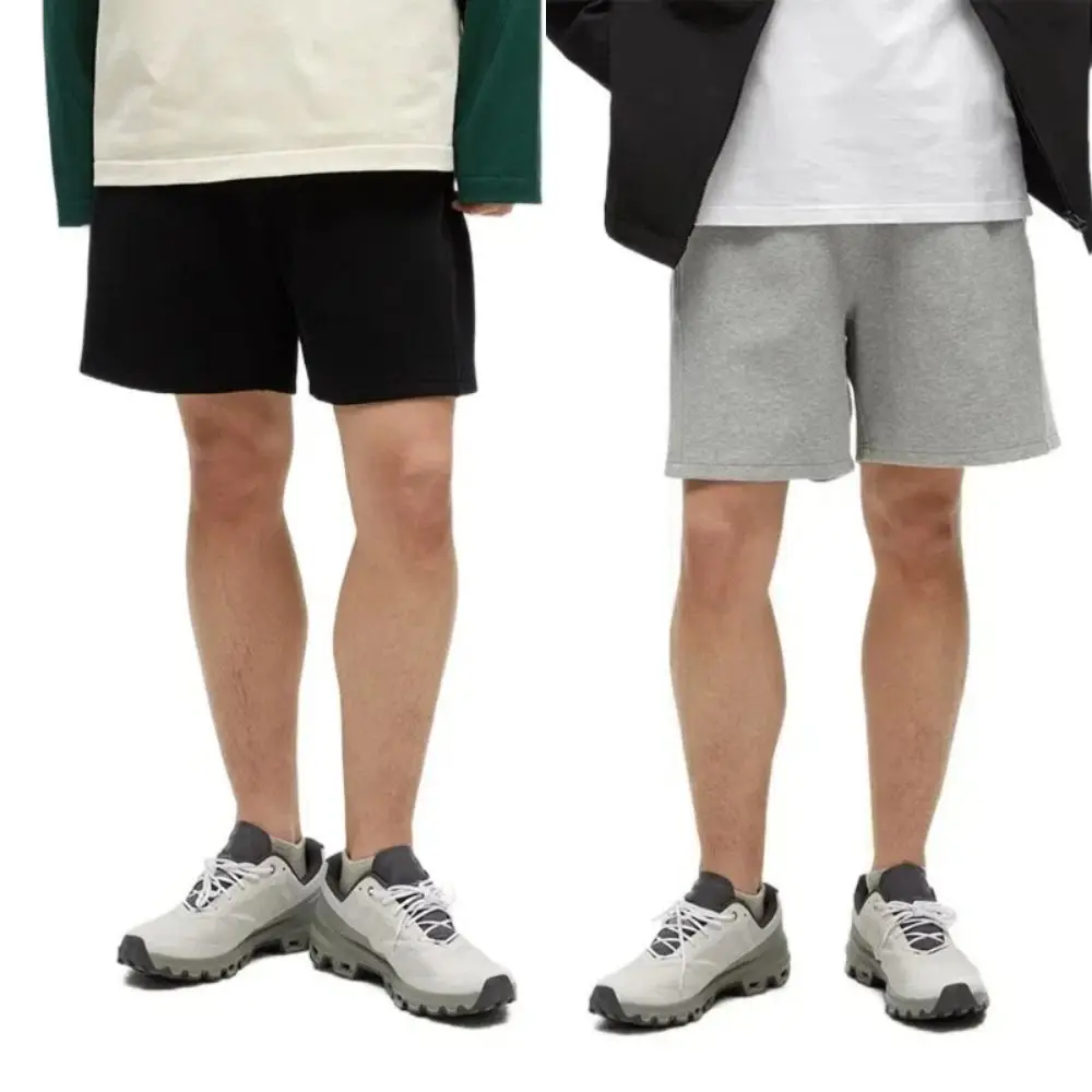 Pantaloncini semplici larghi a vita alta con lacci Pantaloni larghi a mezza gamba tinta unita Pantaloncini causali con coulisse sottile Uomo Maschio