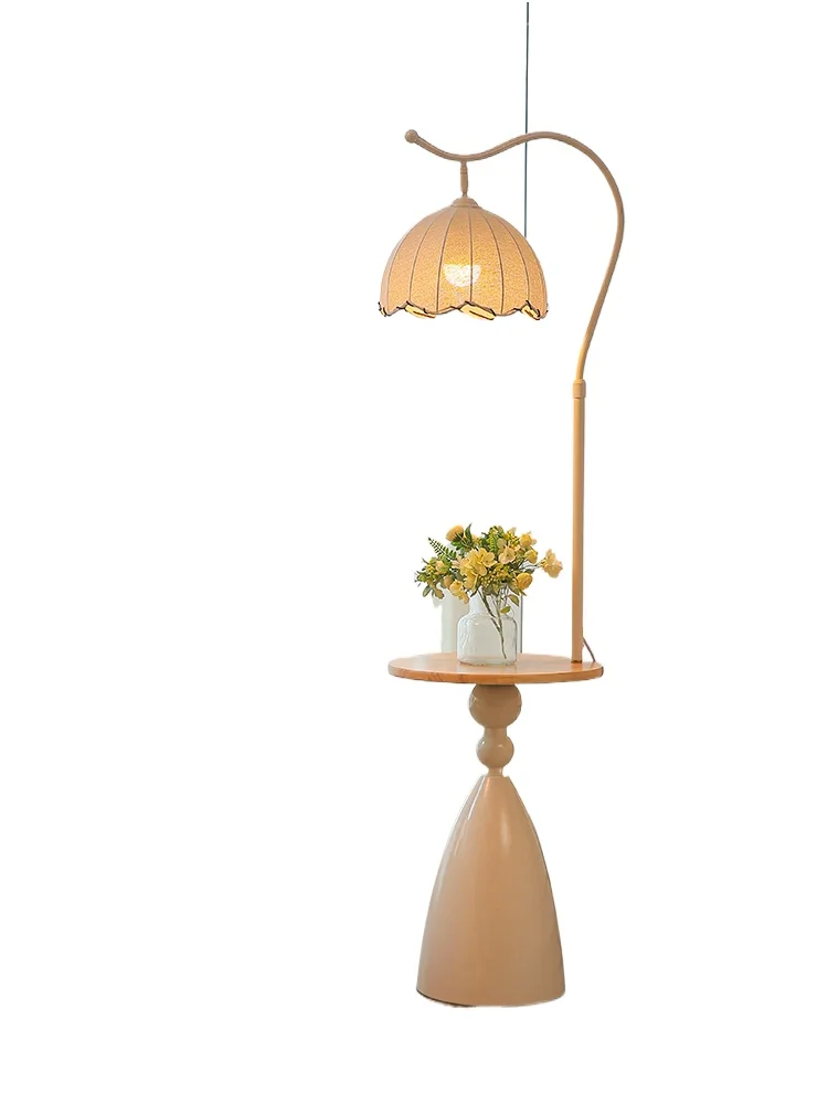 

Shelf integrated floor lamp, living room sofa next to a few ornaments, ambient light
