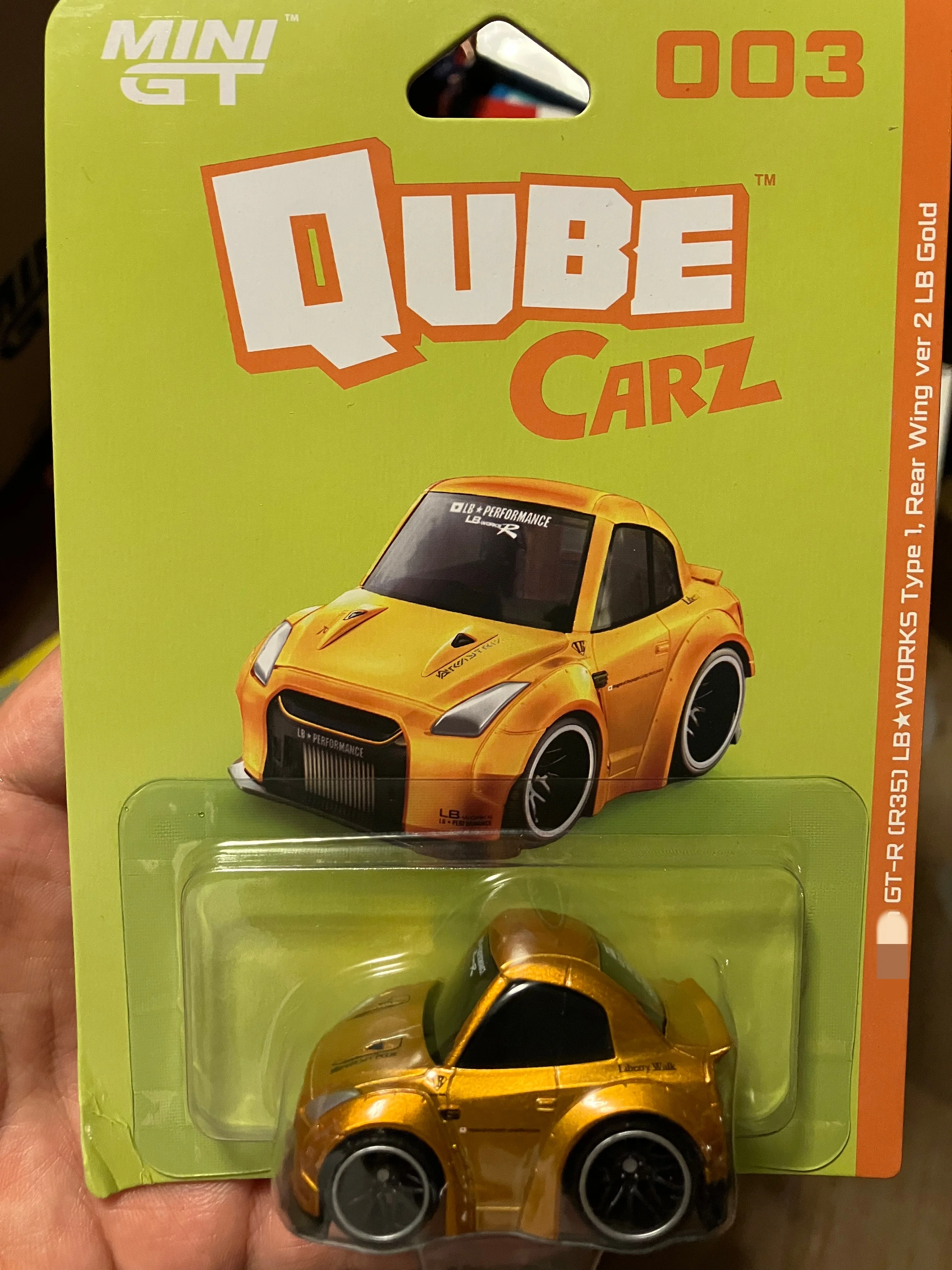 

Модель автомобиля Minigt Qube Carz GT-R R35 LB Works Type 1 с задним крылом Ver 2 LB Gold из сплава