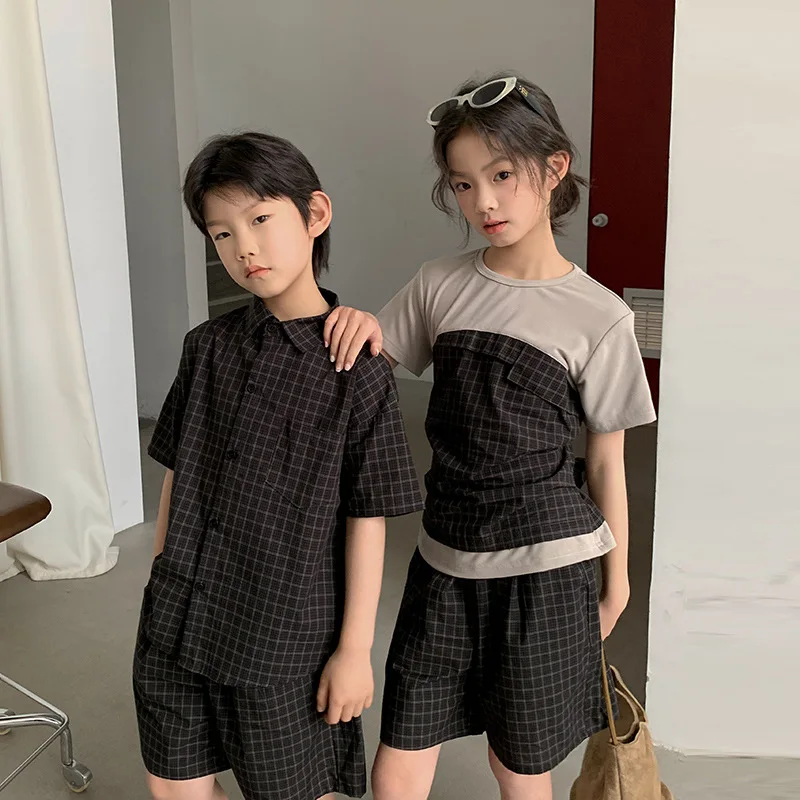 

2026 Summer Fashion Kids Plaid Fake Two Piece Short Sleeve Tops Pants Sets Stylish Sibling Matching Outfits for Big Boys Girls