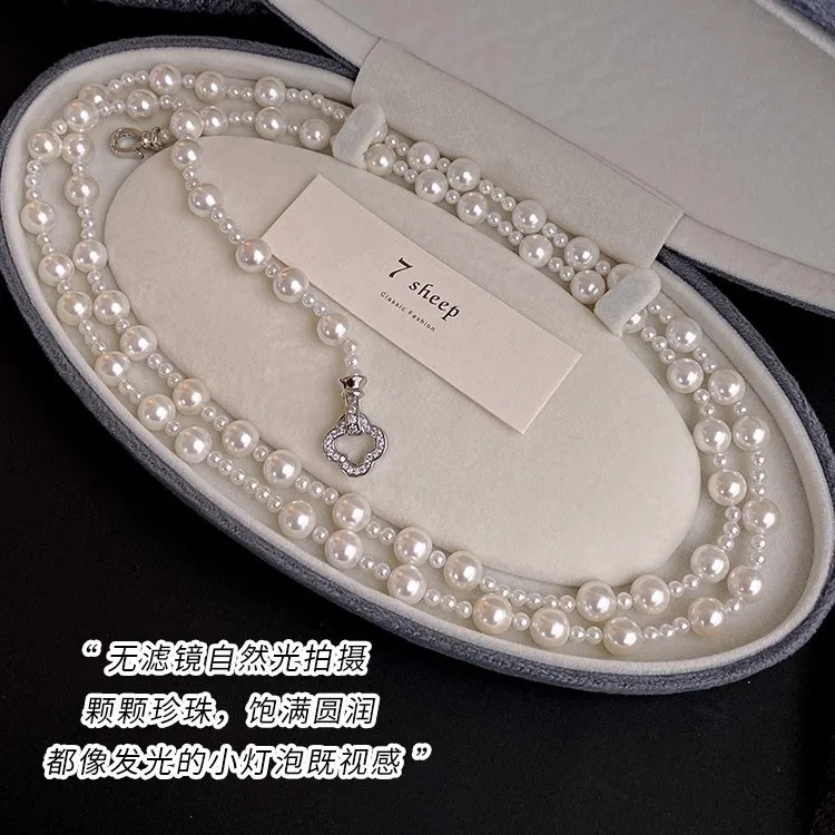 

Shijia strong light pearl necklace women's light luxury niche high-end long stacked sweater temperament trendy neck chain