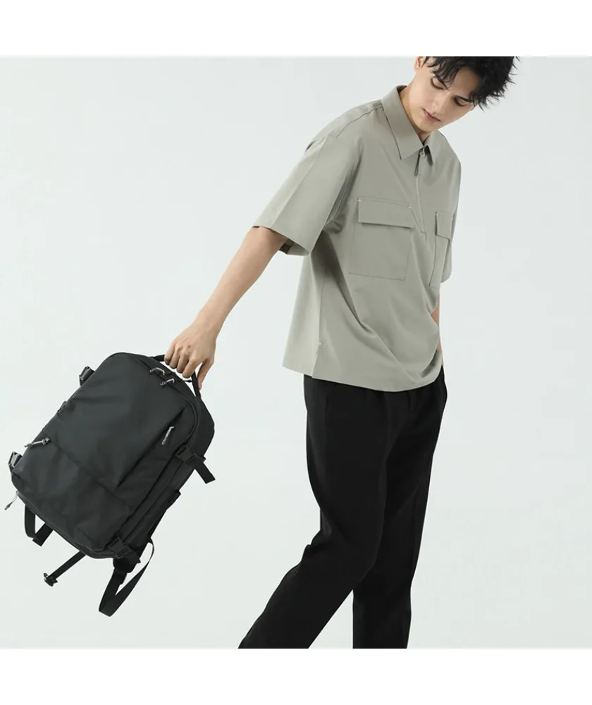 

Black minimalist business backpack with expandable side straps smooth surface suitable for office commute business trips