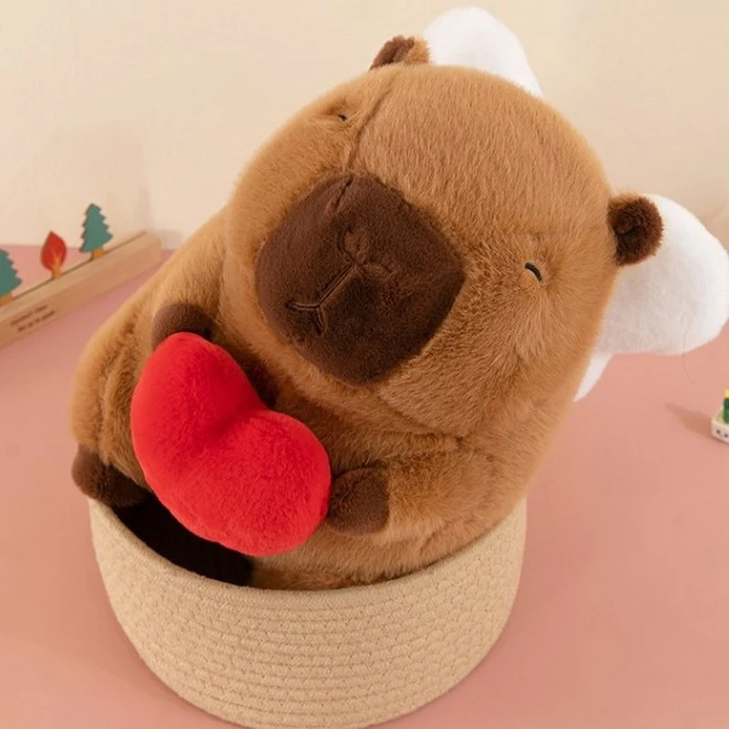 Capibala alas de Ángel abrazando corazón Capybara muñeca Linda juguetes de peluche, adorno de habitación, almohada de juguete, regalo de cumpleaños para niños, Kawaii, nuevo, 25cm