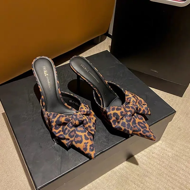 

Leopard Print Baotou Slippers Women 2026 New Thin Heel Bow Pointed Toe Net Infrared Wearing Half Slippers