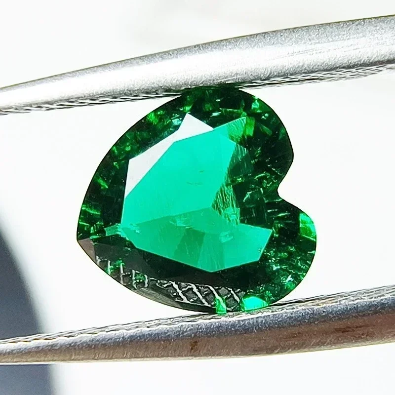 

Lab Grown Zambian Emeralds Heart Shape Hydrothermal Hand Cut with Cracks Inclusions Inside Selectable AGL Certificate