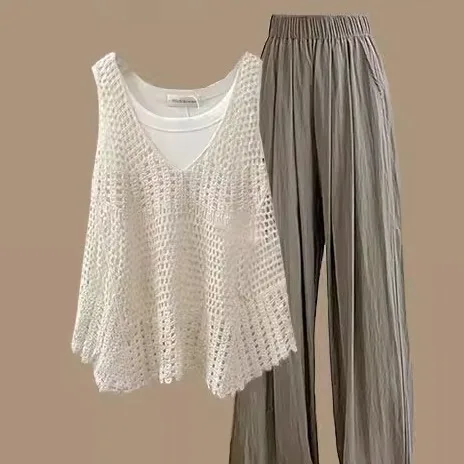 

Летний женский комплект в корейском стиле: брюки с высокой талией и широкими штанинами, топ на бретелях, мягкий и универсальный, подчеркивающий индивидуальность.