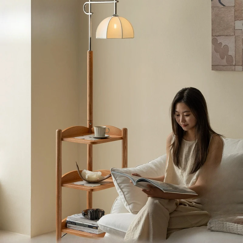

An room antique three-hour floor lamp next to the sofa, bedroom study atmosphere lamp, vertical table lamp, bedside lamp