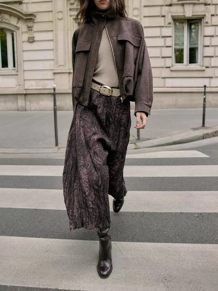 

European-style new women's clothing, fashionable, versatile, elegant, simple, with a belt, printed midi skirt.