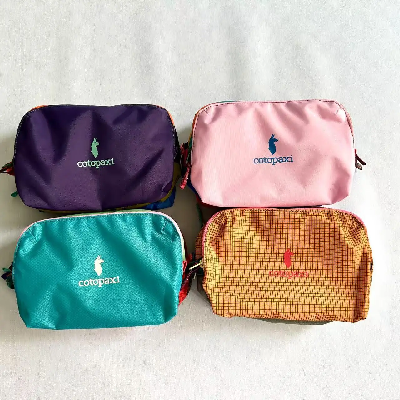 

Cotopaxi toiletry bag, dopamine makeup bag, portable storage bag, outdoor sports single shoulder carrying crossbody bag