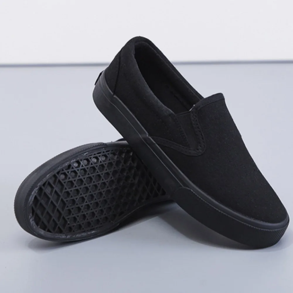 أحذية نسائية مفلكنة أحذية قماشية سوداء جديدة للعمل النسائي أحذية كاجوال مسطحة سوداء نقية أحذية رياضية نسائية