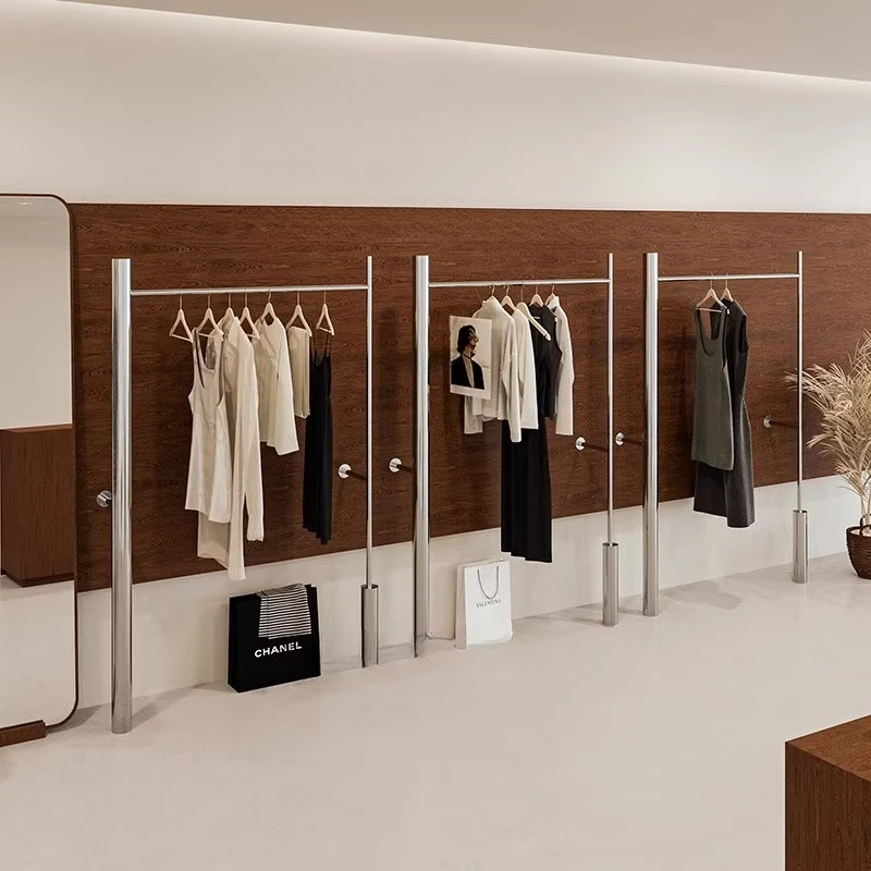 

Clothing store display rack on the wall Stainless steel large tube hanger antique women's clothing store