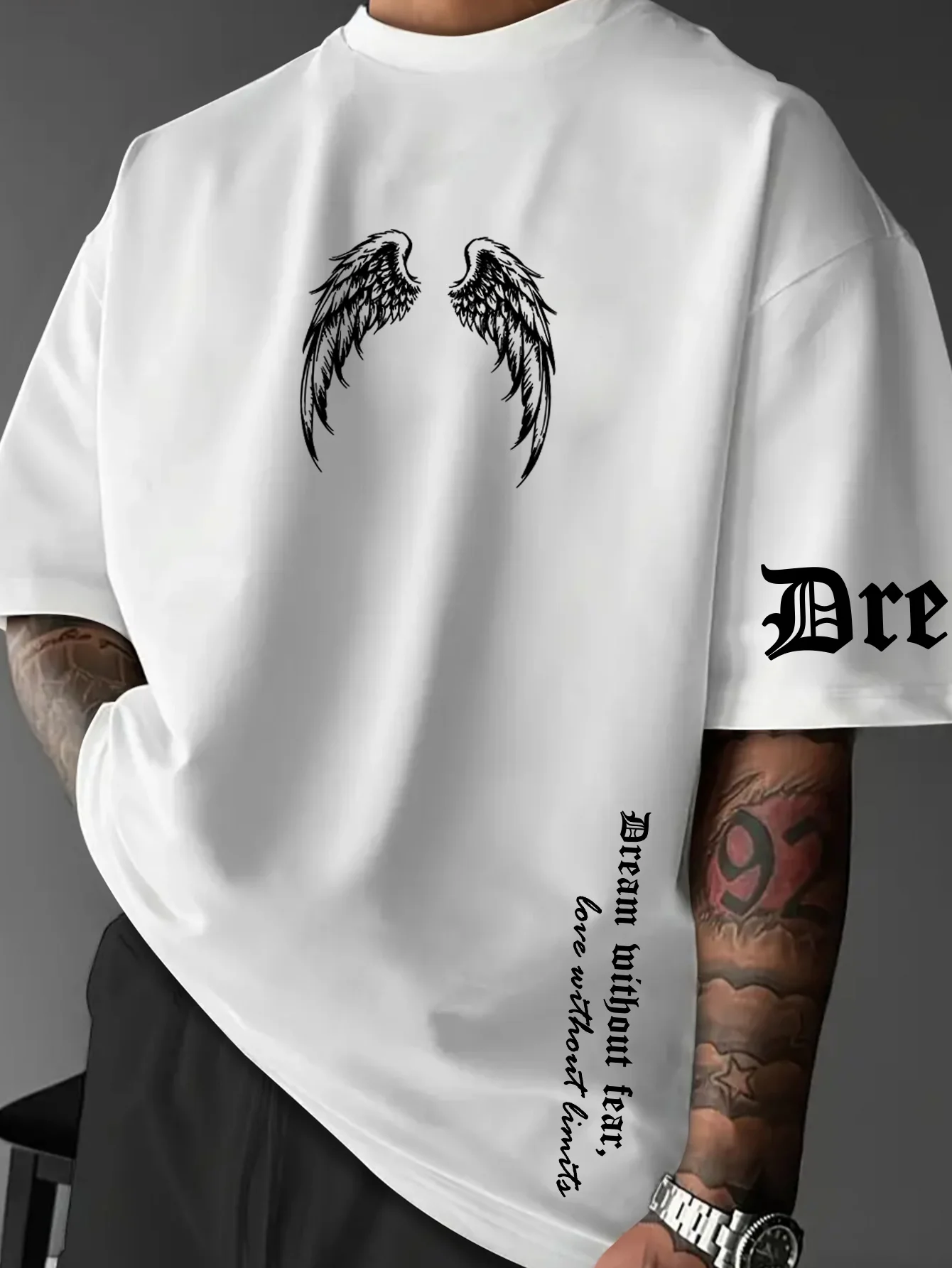 Gothic inspirational style T-shirt for men, featuring wing prints and text embellishments.  Couple's streetwear for all seasons.