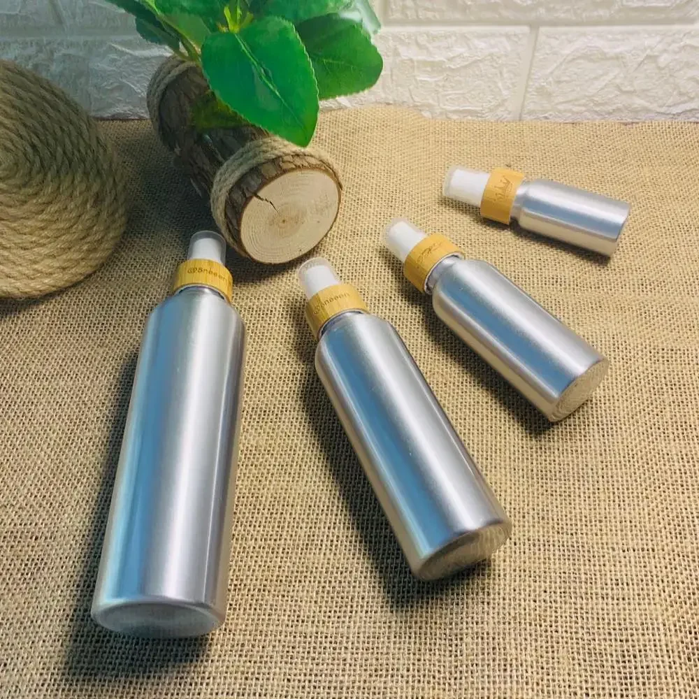 

Refillable reacycle Plastic Bottle new product cosmetics packaging round shouldered aluminum bottles with bamboo wooden lid
