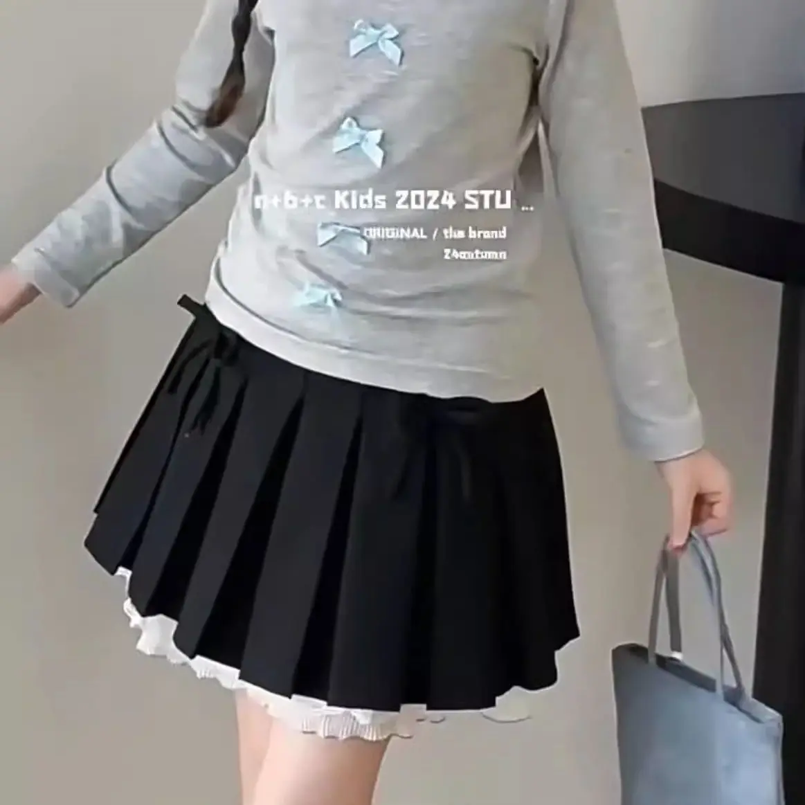 2026 New Stylish Fashion Autumn Wear Childrens Wear Skirt Korean Bow Knot Pleated Girls Outerwear Short Skirt
