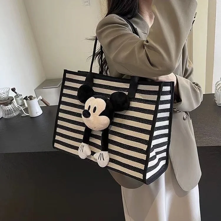 

Large capacity striped tote women's shoulder 2024 new fashionable cute cartoon Mickey doll commuting canvas bag for going out