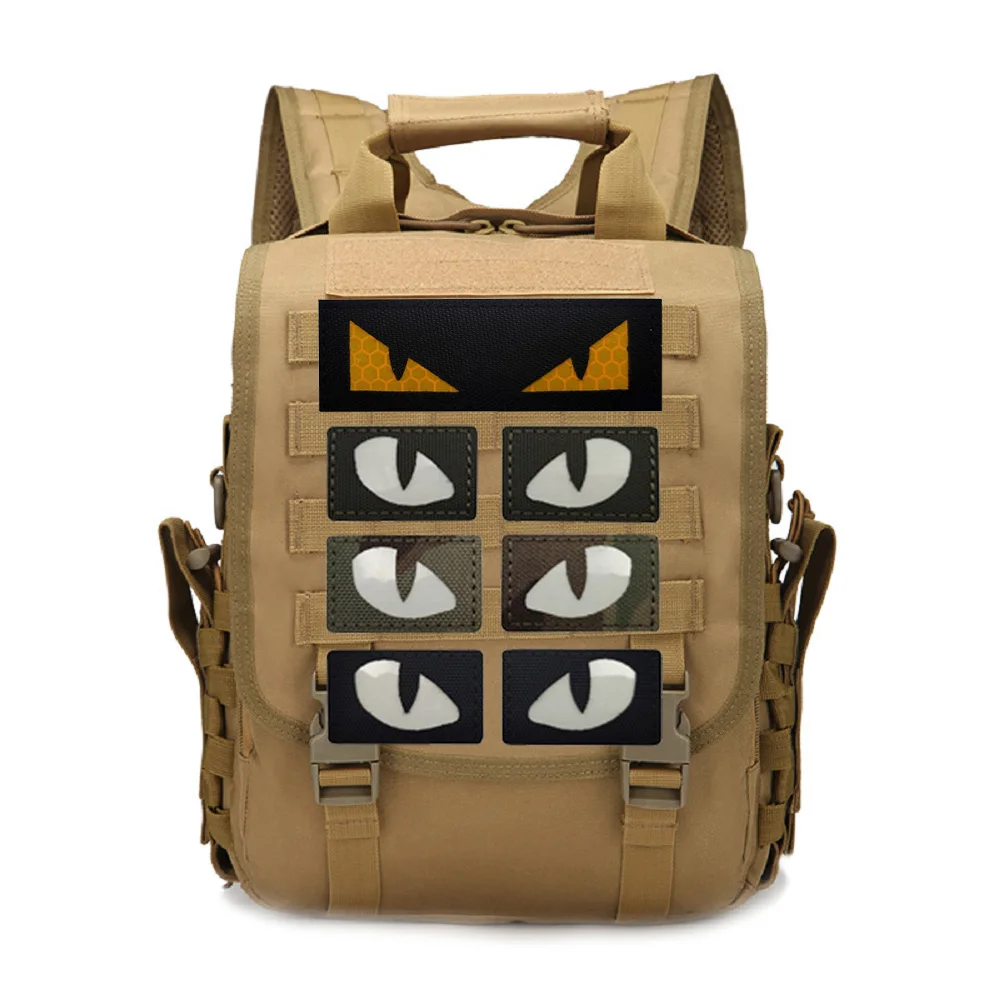 Outdoor Glow-in-the-dark Demon Eyes Badge Cat Eye Morale Tactical Creative Cat Eye Clasp Backpack Hat Outdoor MOLLE Pendant