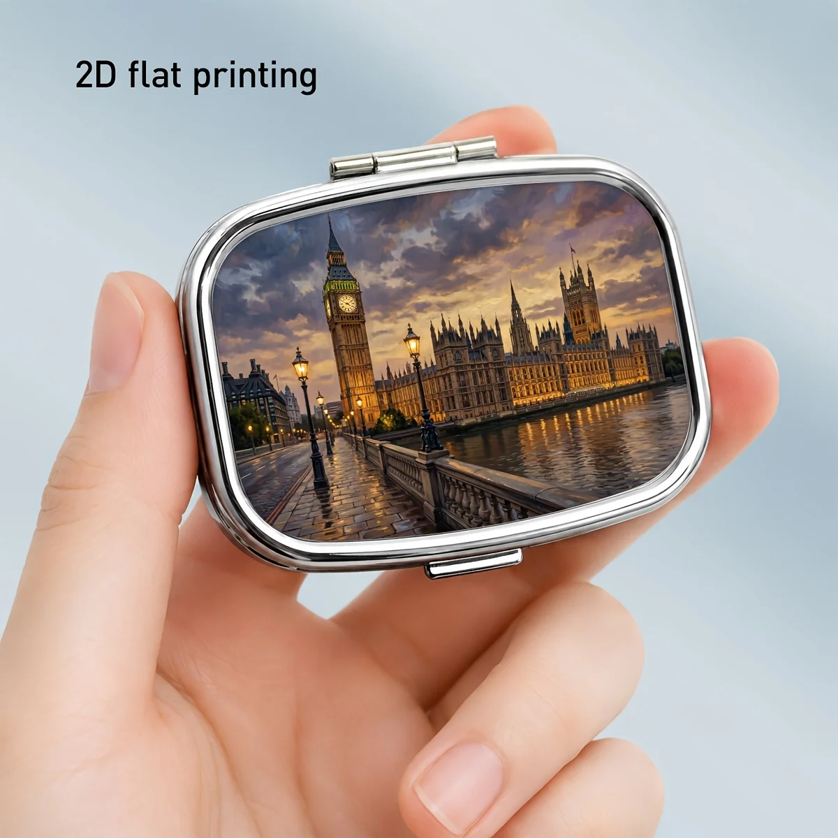 Square Metal Pill Box with a Sunset Big Ben Riverfront Pattern, Visually Gentle and Elegant, Combining Decorative and Practical Features. Two-Compartment Portable Storage Box for Organizing Small Items, Jewelry, Medicines, and Vitamins. the Compartmented Design Makes It Easy to Access, and Its Size Allows It to Fit into a Handbag or Luggage, Suitable for Daily Travel, Beautiful and Durable.