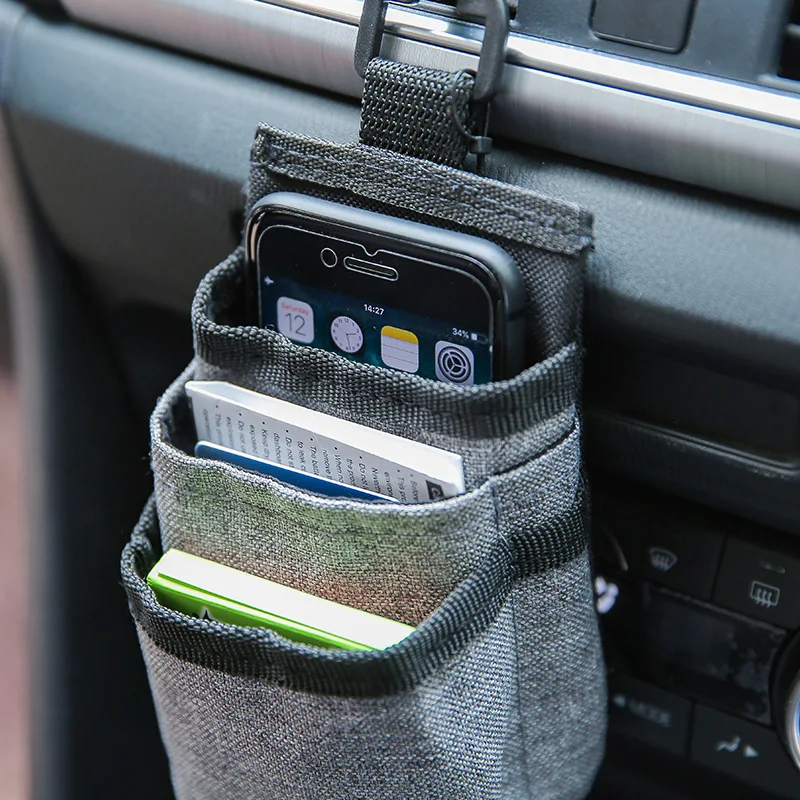 

Car vent storage bag, car mobile phone power bank, certificate and other storage bags with data cable holes, car hanging bag