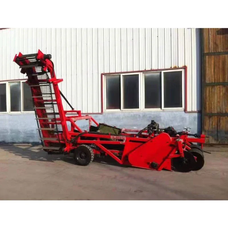 Suspended tractor drives large potato combine harvester, potato harvesting and loading machine