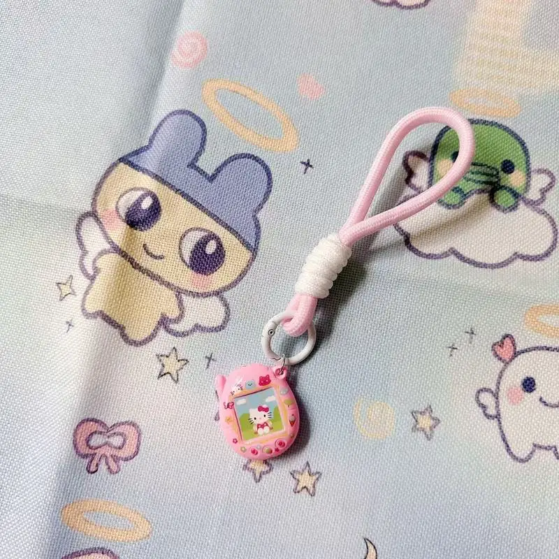 لطيف Tamagotchi الكرتون أنيمي المفاتيح الإبداعية النايلون الحبل للهواتف المحمولة والحقائب - هدية مثالية للصديقات