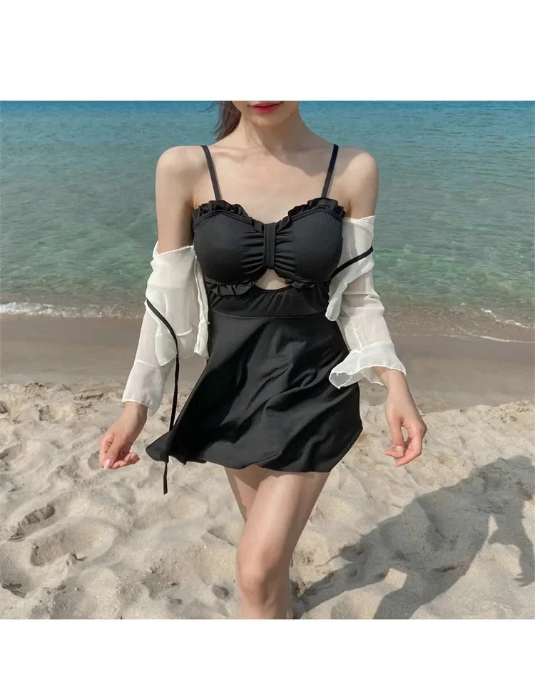 Nuevo vestido de una pieza para mujer, estilo conservador, que cubre la carne, blusa de manga larga con protección solar ligeramente gorda, junto al mar